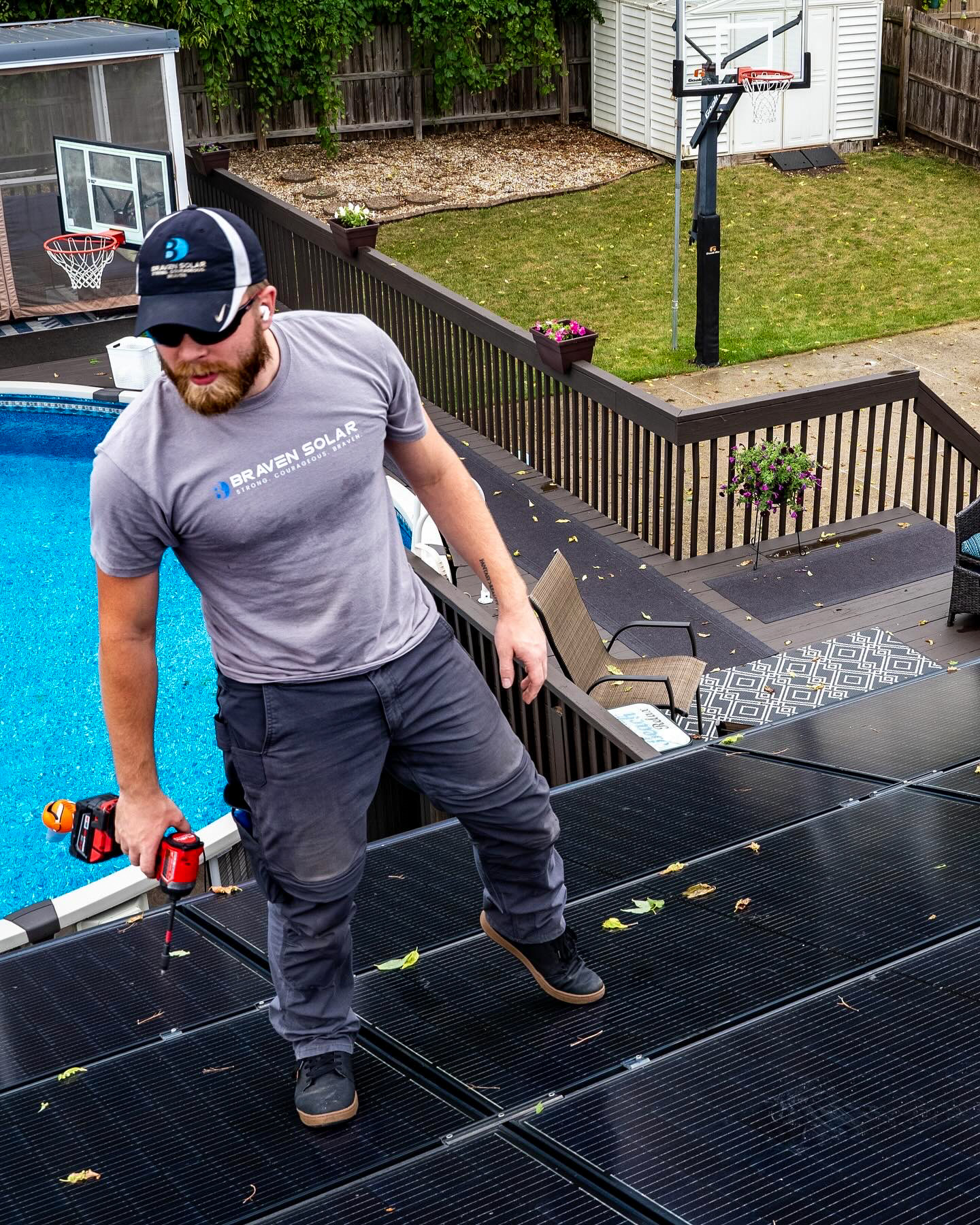 Braven Solar installer in branded gear working on a Northern Illinois rooftop solar system